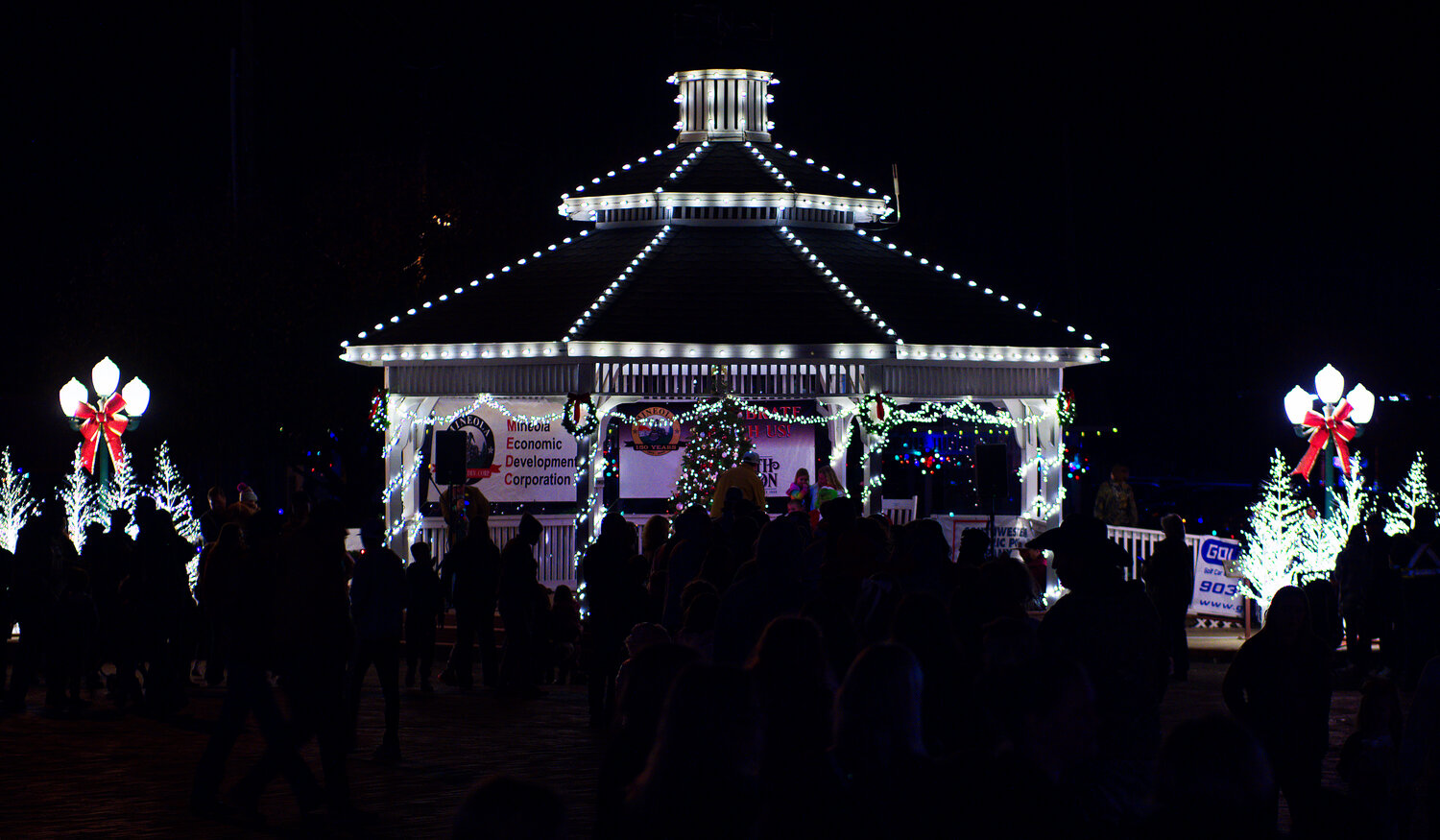 The gazebo was lit up brightly, in contrast to the surrounding downtown area. [more Mineola merriment]